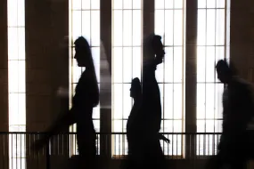 Silhouettes of people inside Main building