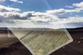 Reflection of a map in a car window