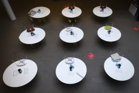 Empty chairs at empty tables in Gimli