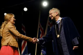 Jón Atli Benediktsson congratulating one of the candidates at a graduation ceremony in University of Iceland