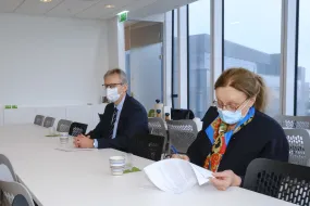 Jón Atli Benediktsson and Alma Möller signing agreement of Heilsubrunnur