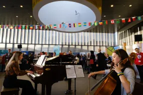 People playing piano and cello at University centre