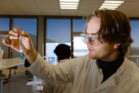 Student in chemistry with a test tube