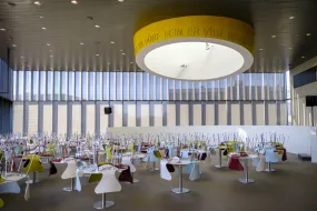 Empty chairs at empty tables at University centre