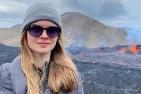 Elif Yaman, volcanic eruption in background