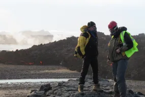 Earth scientists from University of Iceland by a fresh lava