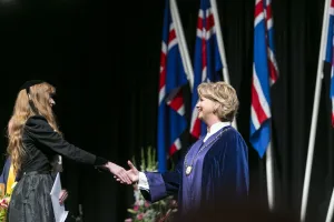Kristín Ingólfsdóttir, rector of the University of Iceland at a graduation ceremony, congratulating one of the candidates